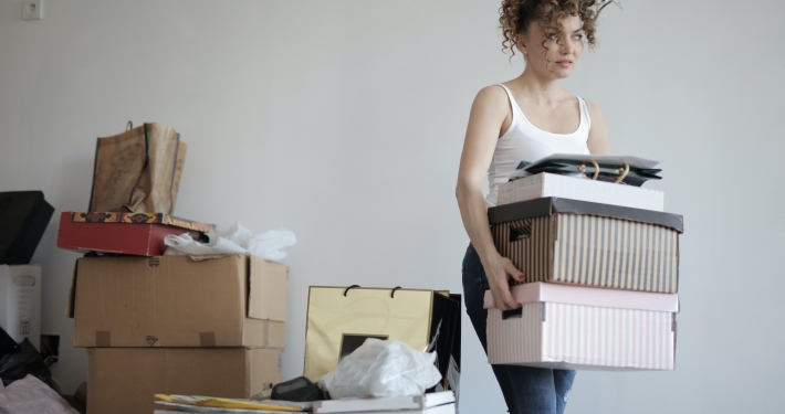 women packing moving boxes